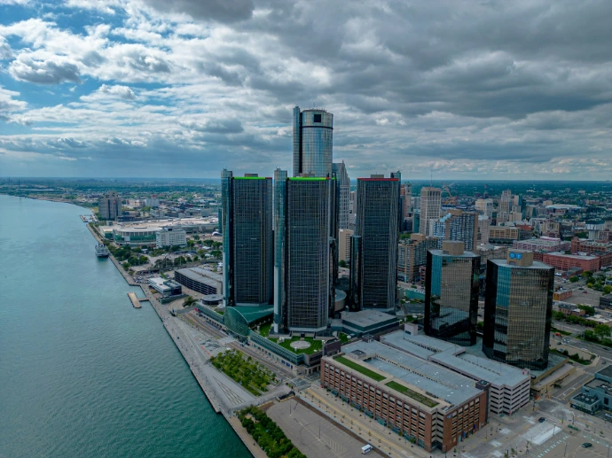 an aerial view of a city and a body of water